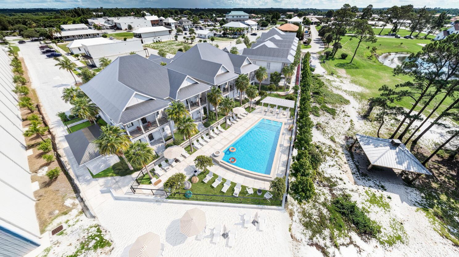 an aerial view of residential houses with outdoor space