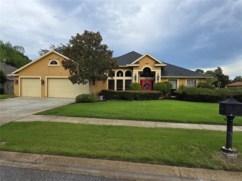 a front view of a house with a garden