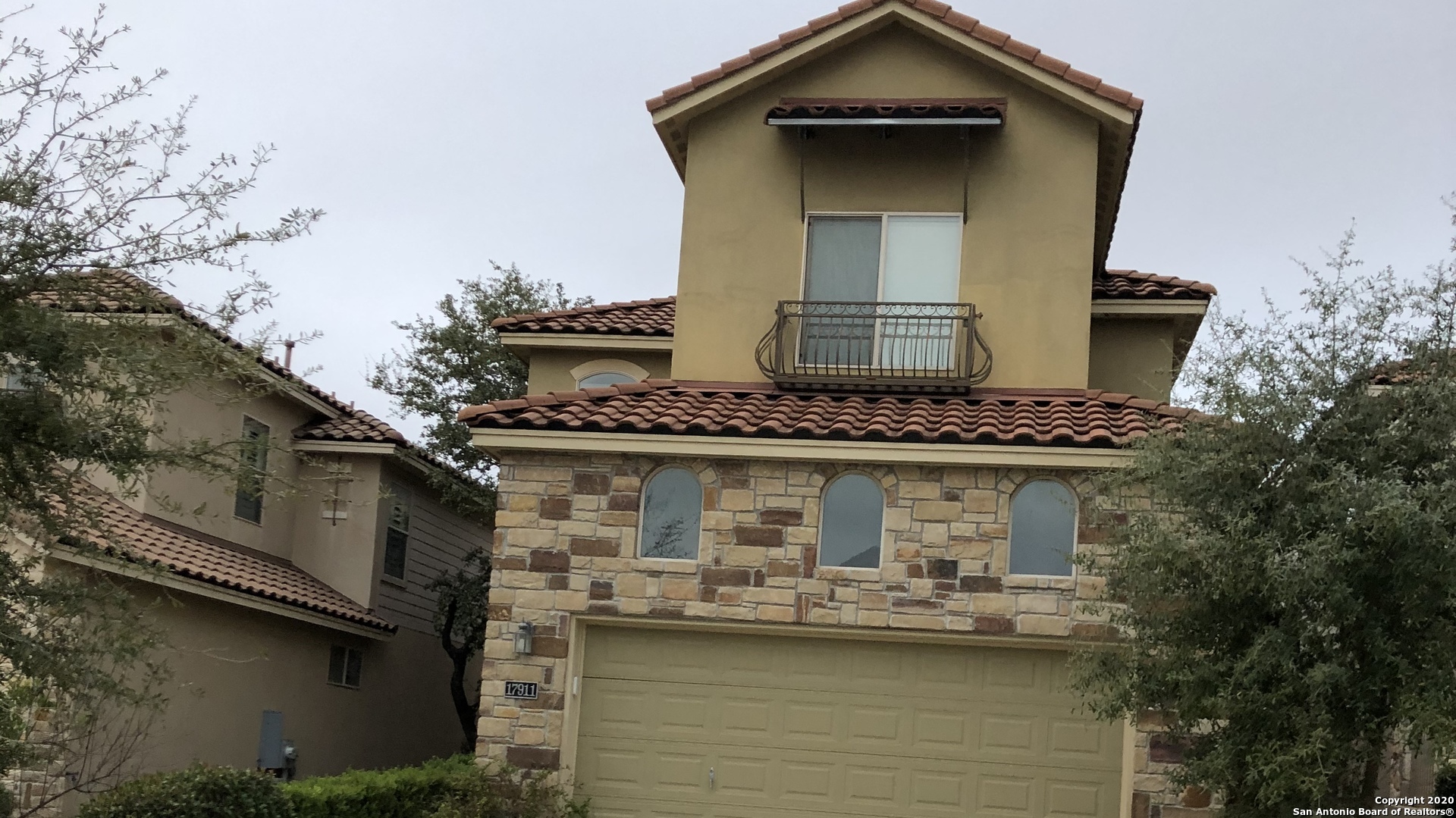 a front view of a house with swimming pool