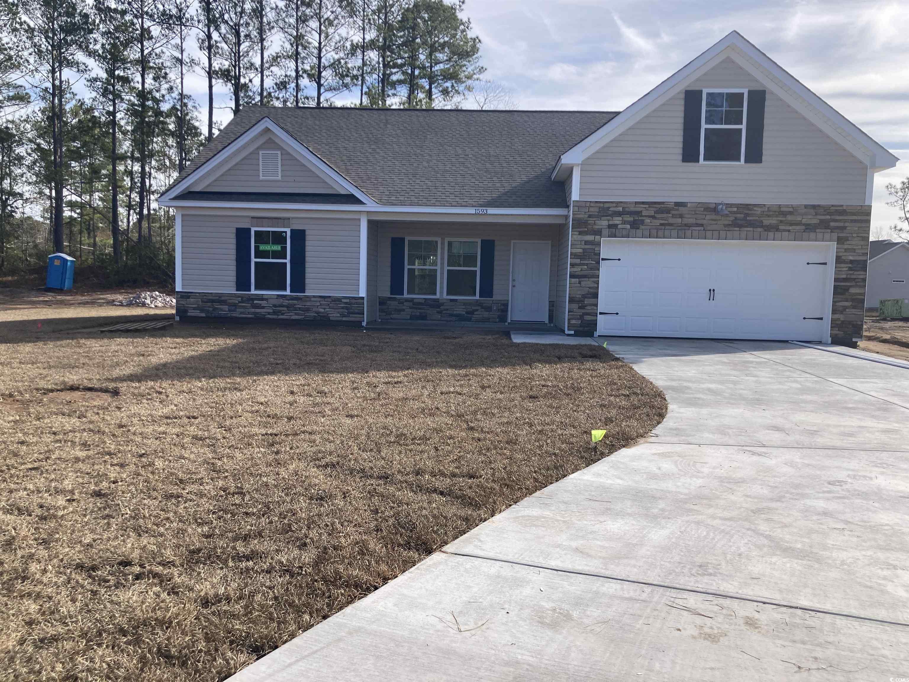 View of front facade featuring a garage