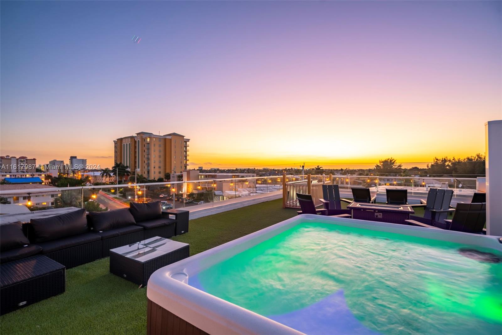 a view of a swimming pool and couches in a patio