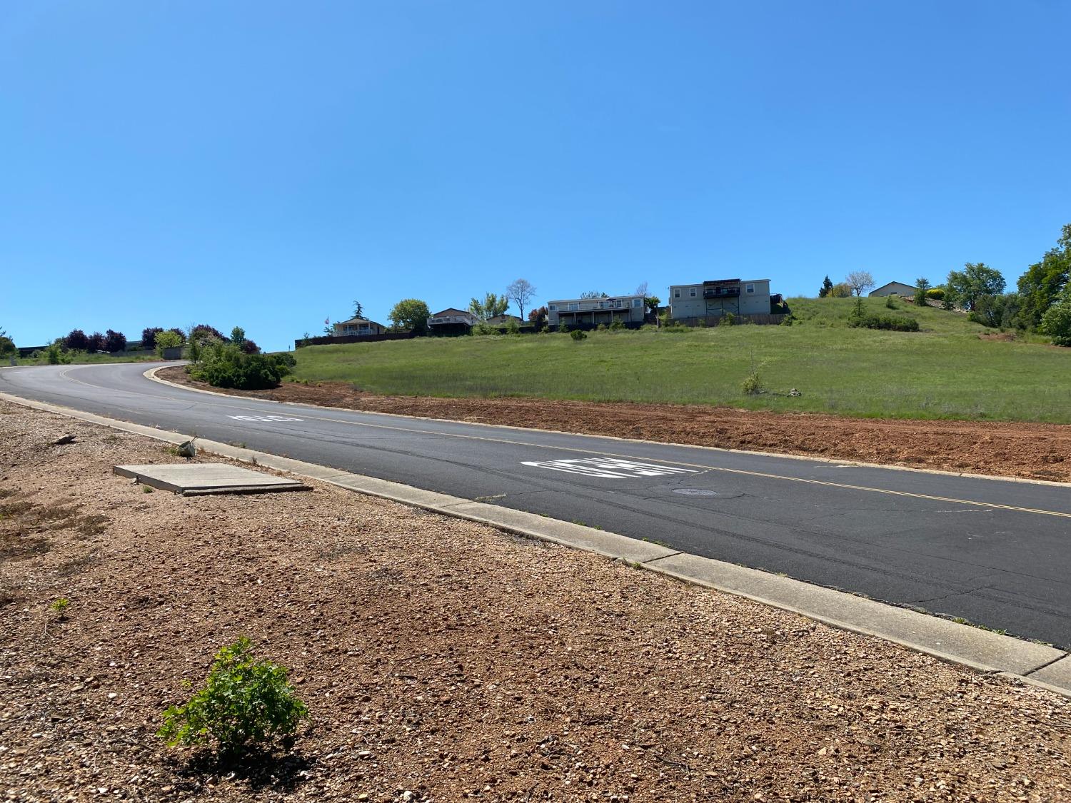 a view of a road with a building in the background