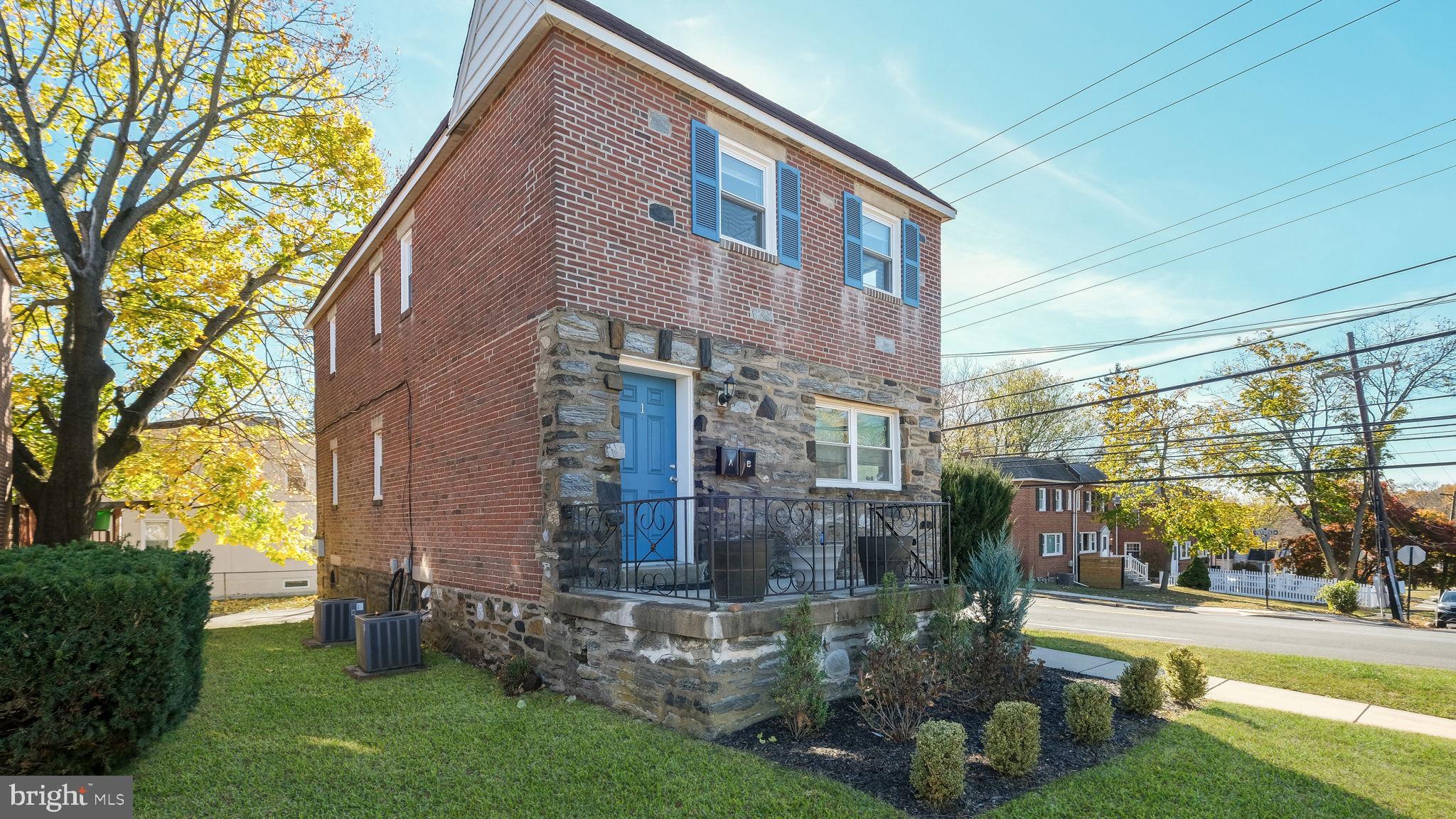 a view of a brick building next to a yard