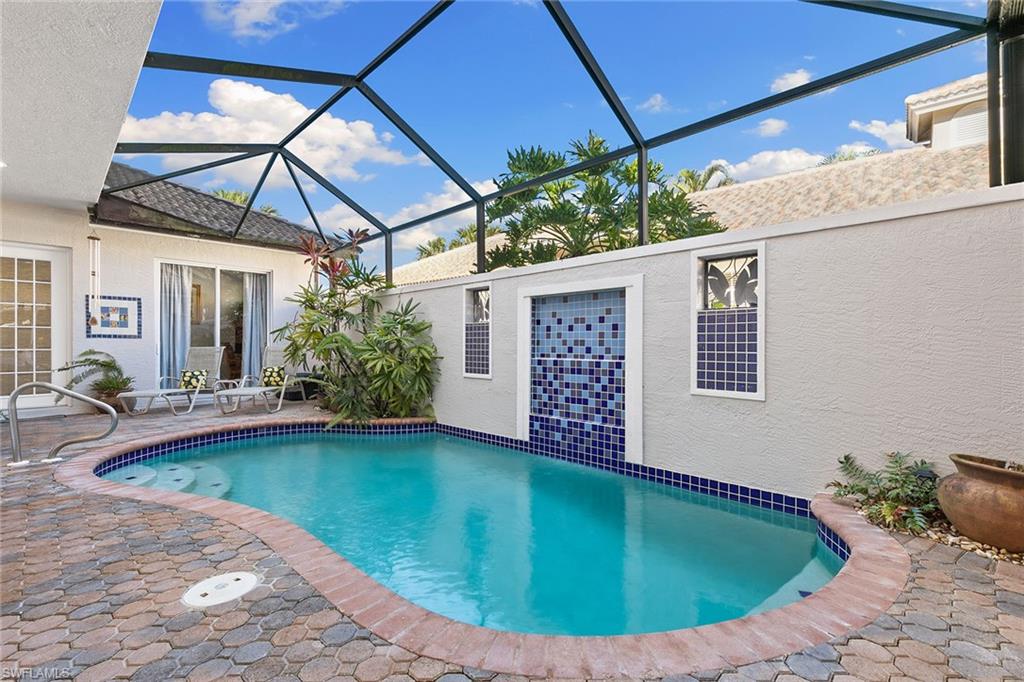 a view of a backyard with swimming pool