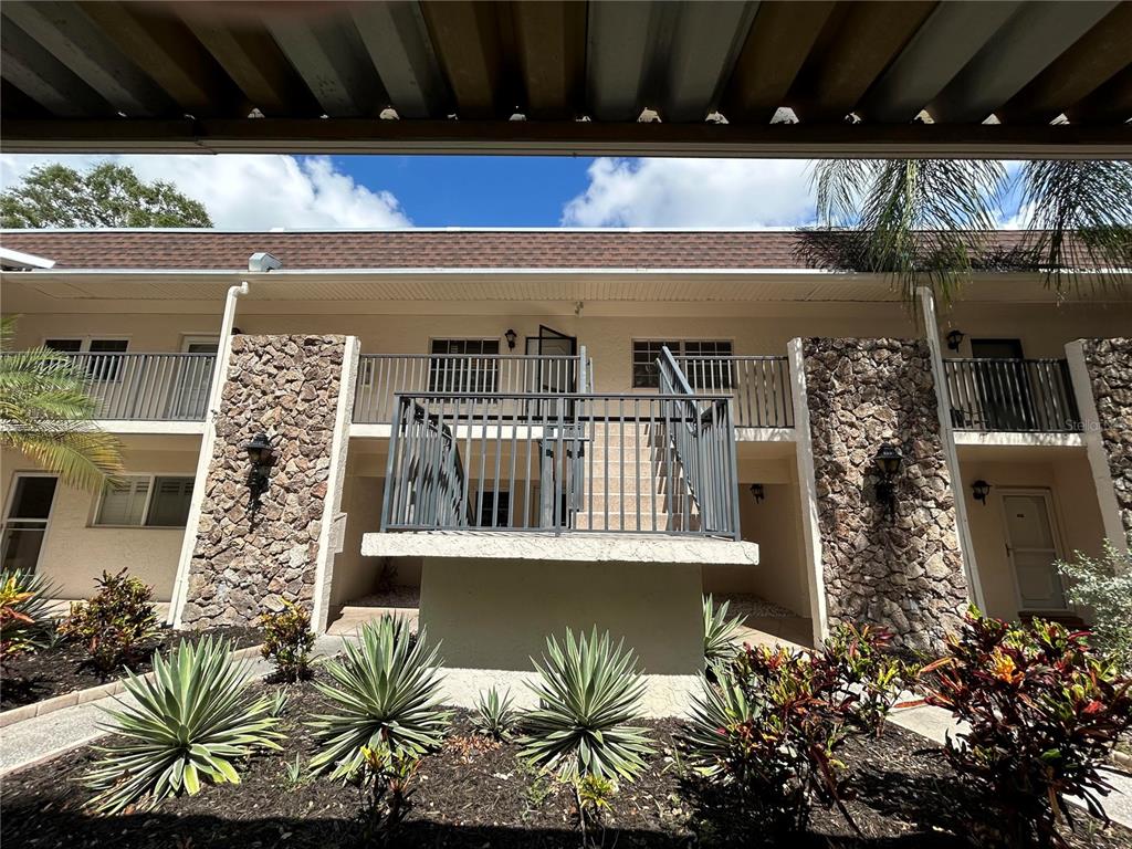 a view of a balcony with plants