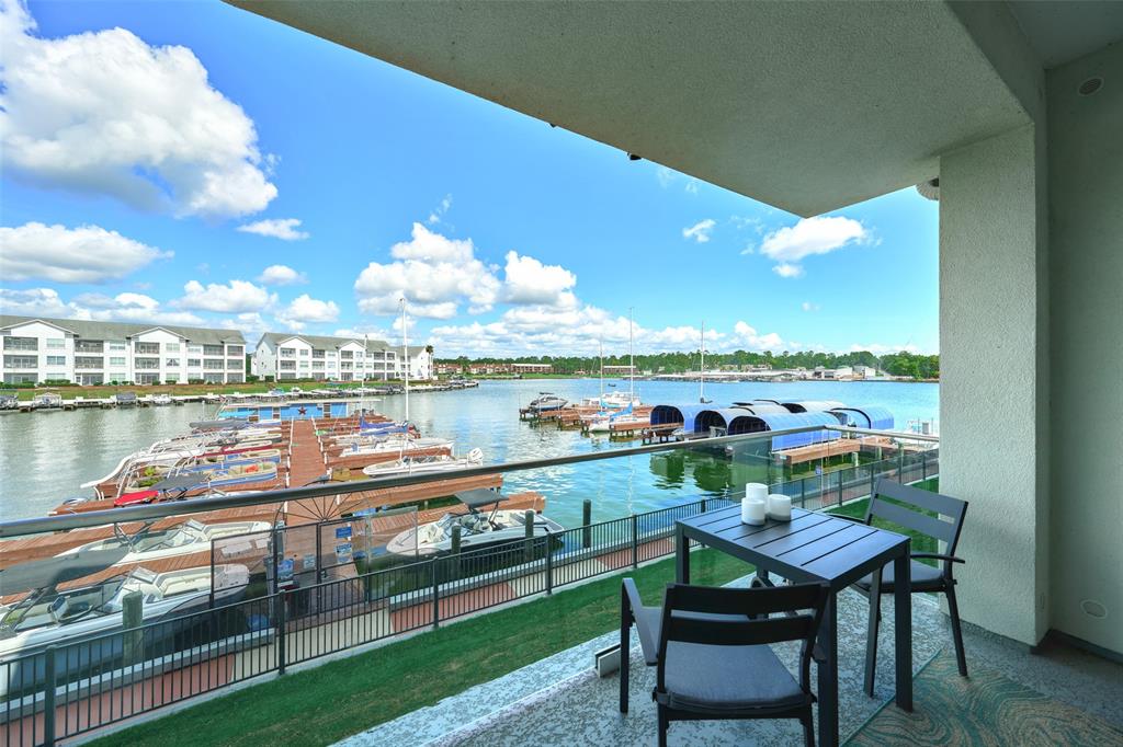 Enjoy Lake Conroe's premier lifestyle at the elegant and private Shoreline on Lake Conroe community.  Easy access first floor living with a beautiful view over Lake Conroe and the area marina.  Unit 104 is 2 bedrooms/2 bath with high ceilings, neutral color scheme and fabulous view! 199 Waterpoint Court Unit #104.