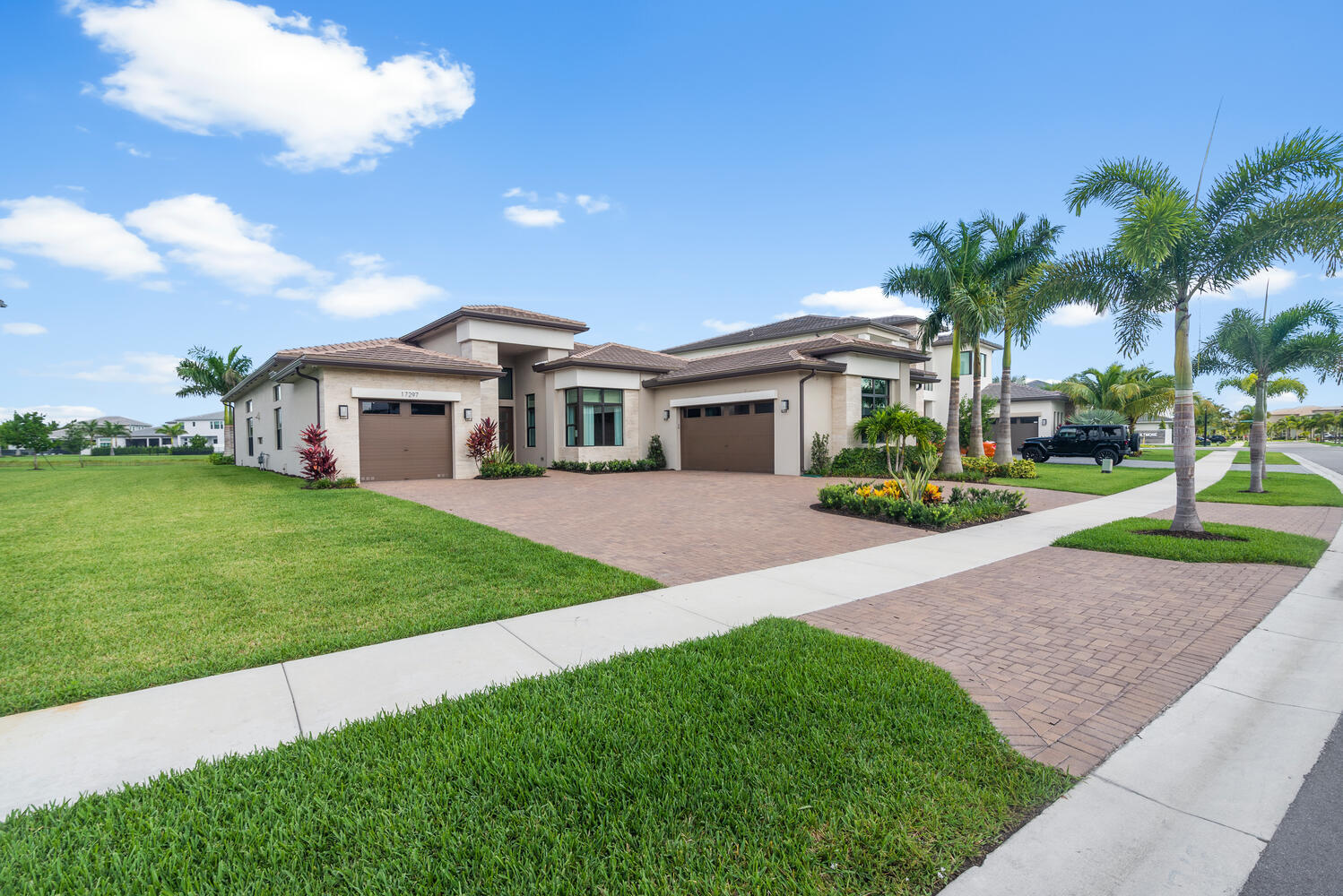 a front view of house with yard and green space