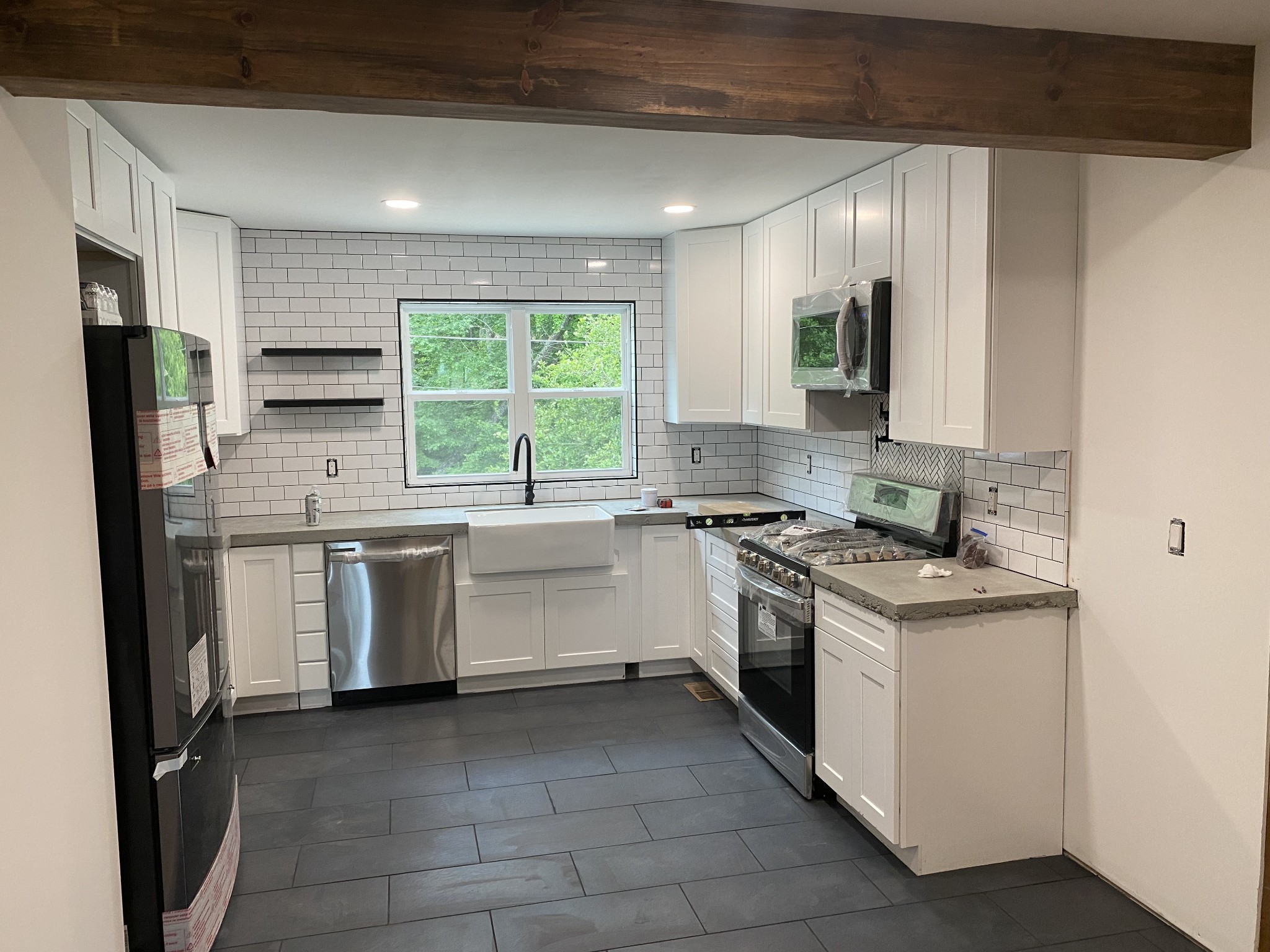 a kitchen with a sink stove and refrigerator