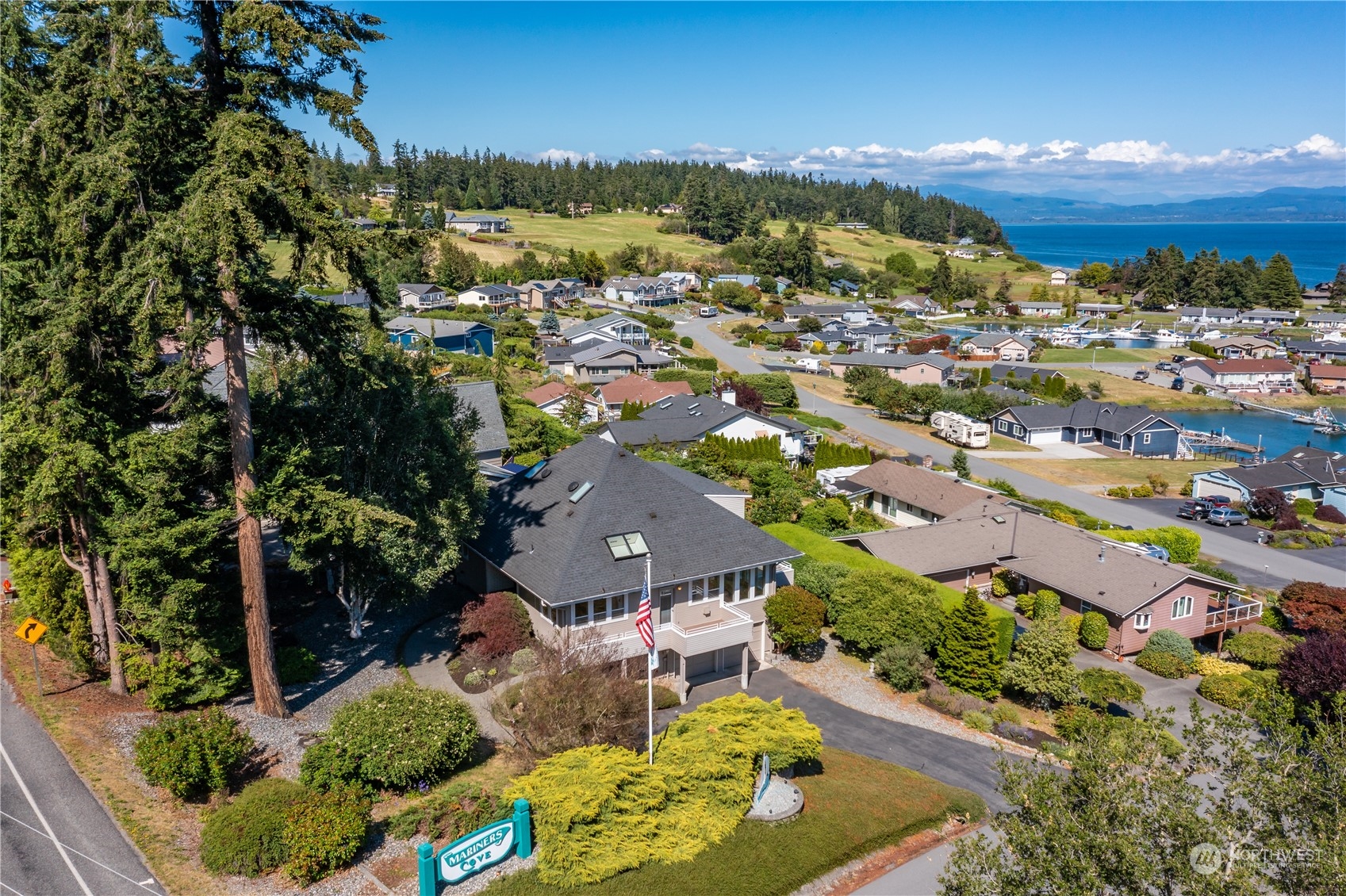 an aerial view of residential houses with outdoor space and street view