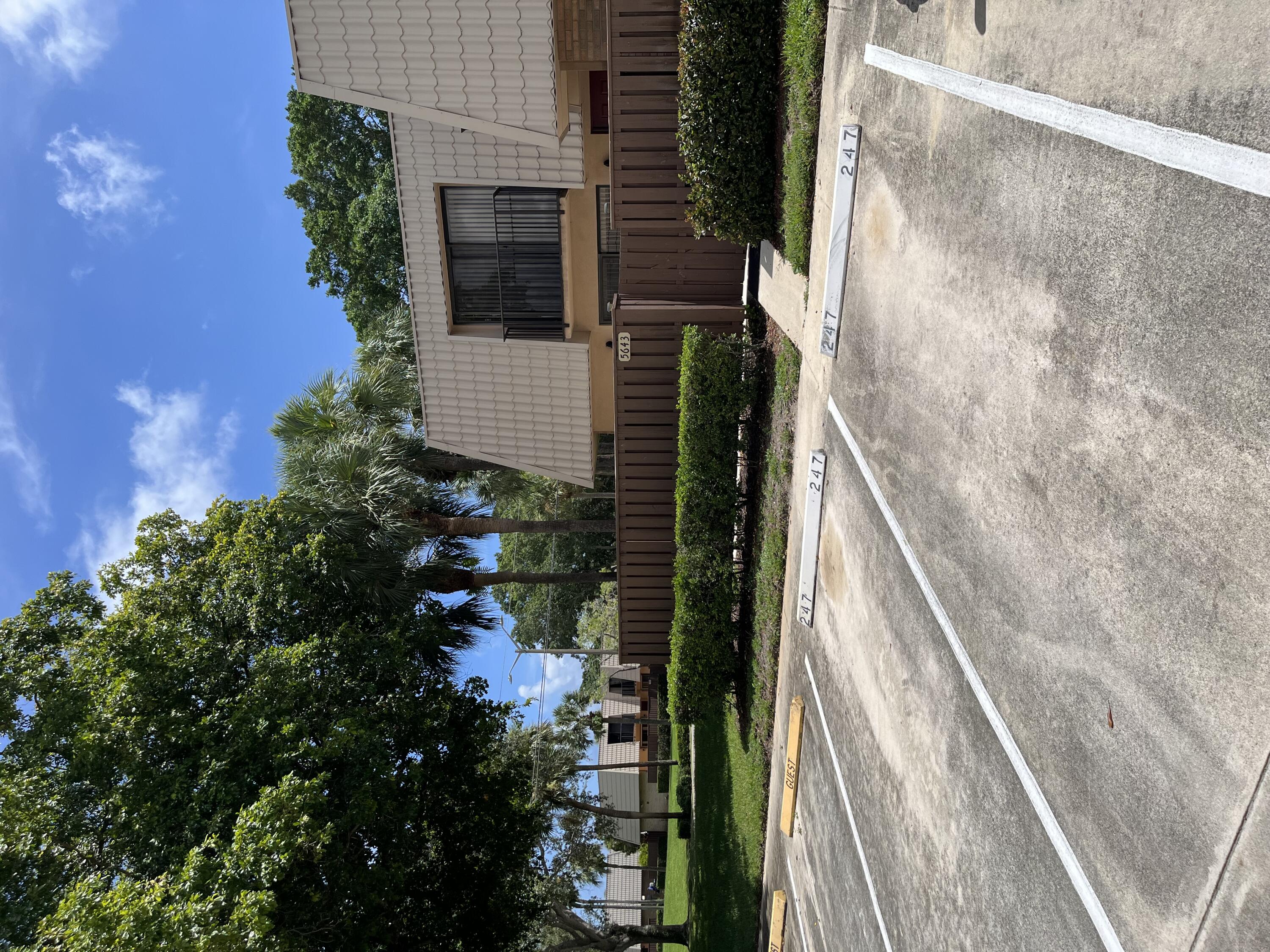 a view of a house with a yard and plants