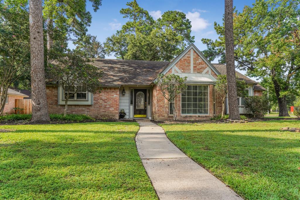 a front view of a house with a yard and porch