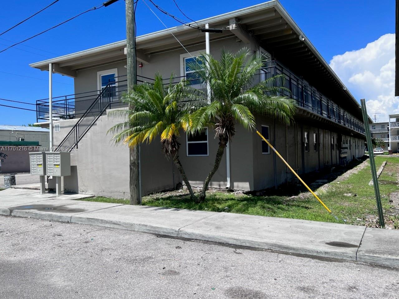 a house that has a tree in front of it