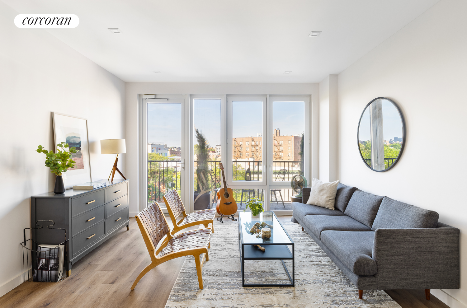 a living room with furniture and a large window