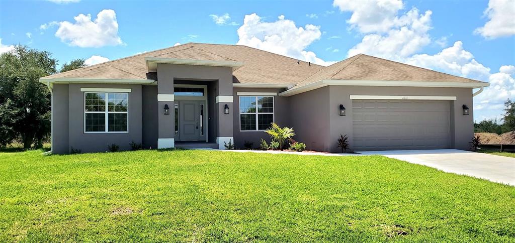 a view of a house with yard and entertaining space