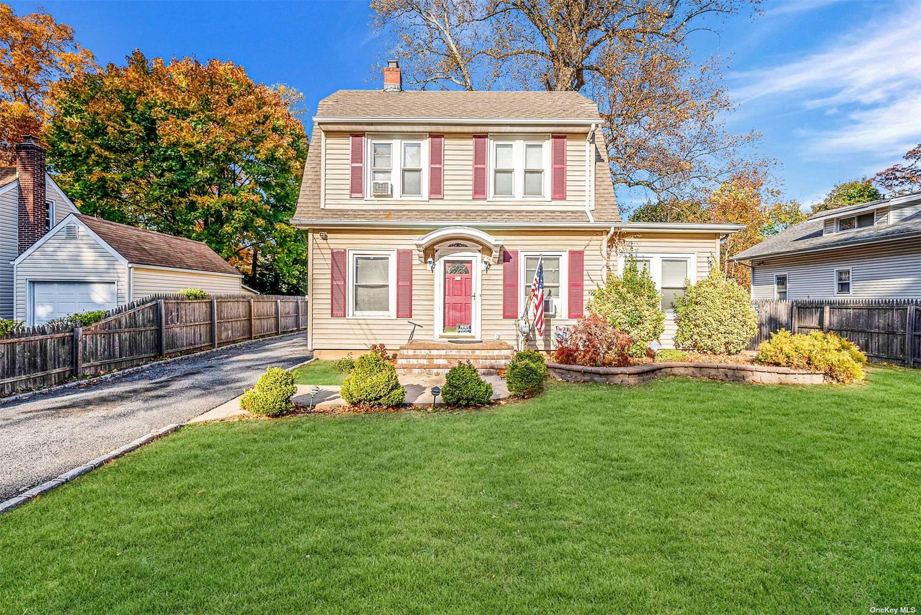 a front view of house with yard and outdoor seating