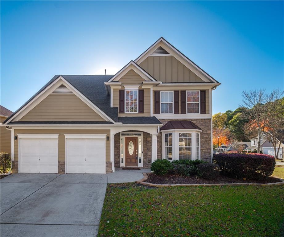 a front view of a house with a yard