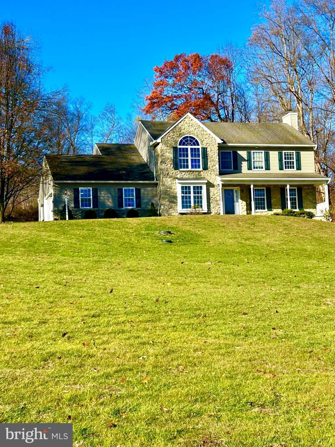 a front view of a house with swimming pool