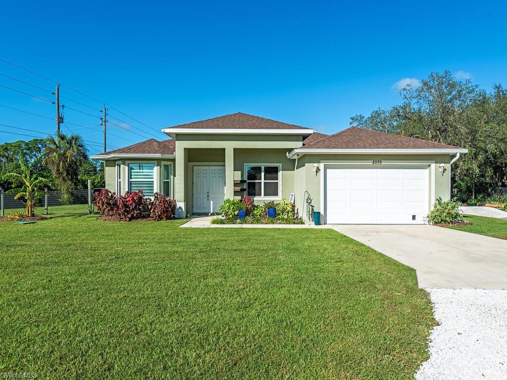 a view of a house with a yard