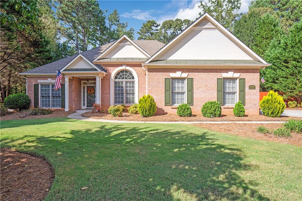 front view of a house with a yard