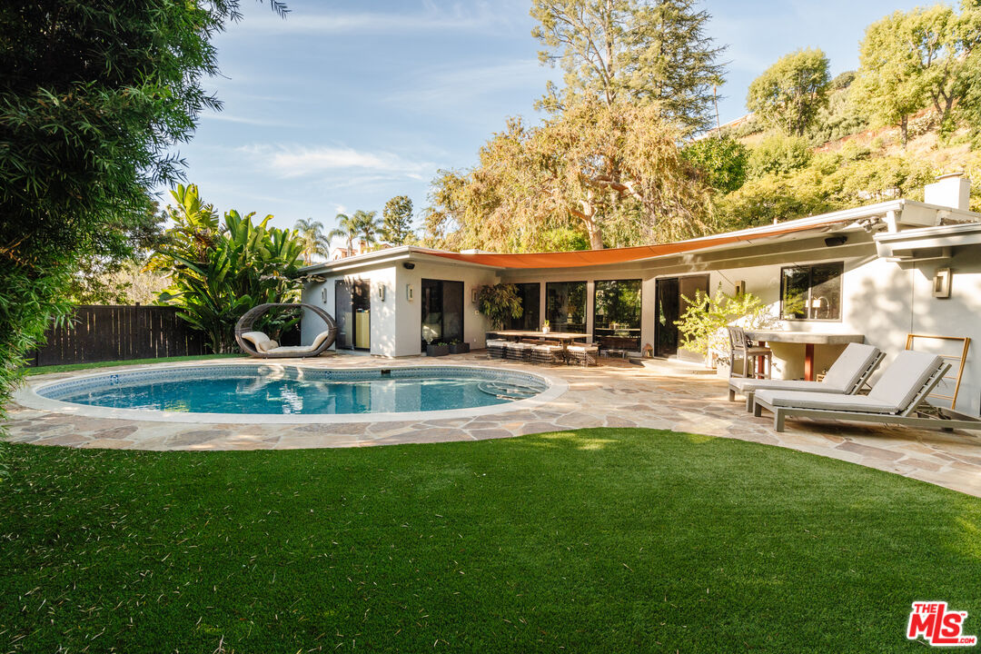 a view of a house with a yard patio and a patio