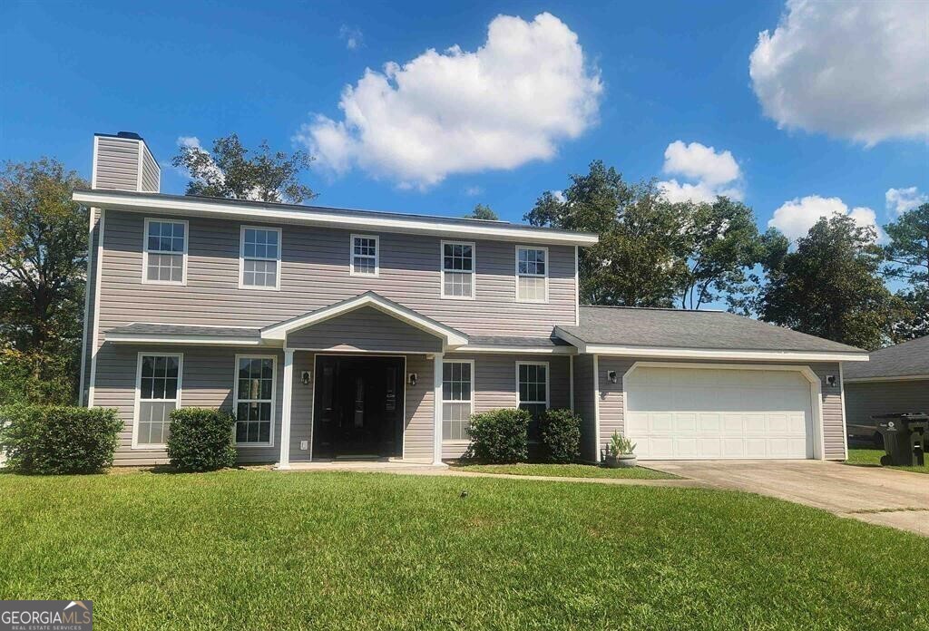 front view of a house with a yard