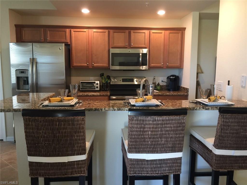 a kitchen with a sink cabinets and stainless steel appliances