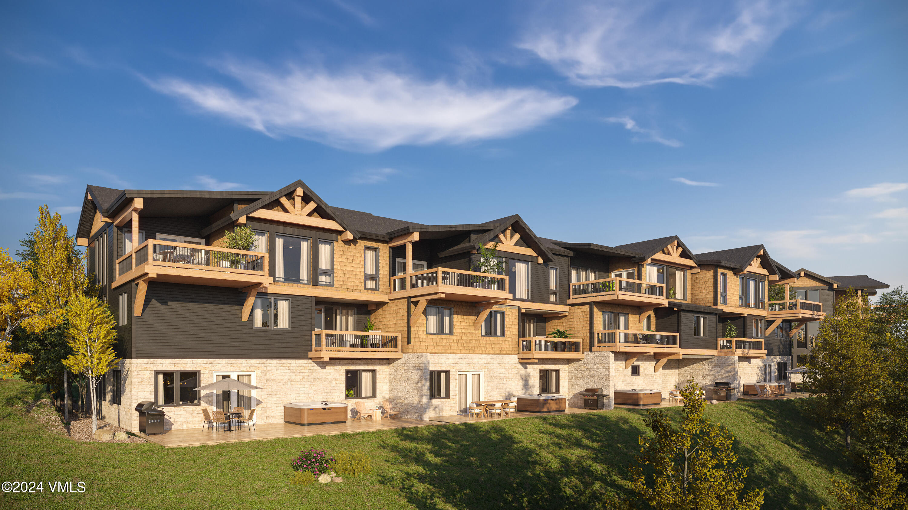 a front view of a residential apartment building with a yard