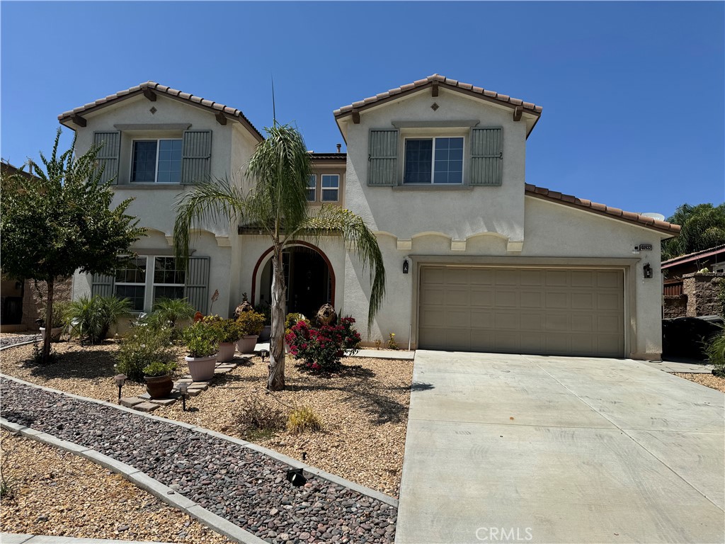 a front view of a house with yard