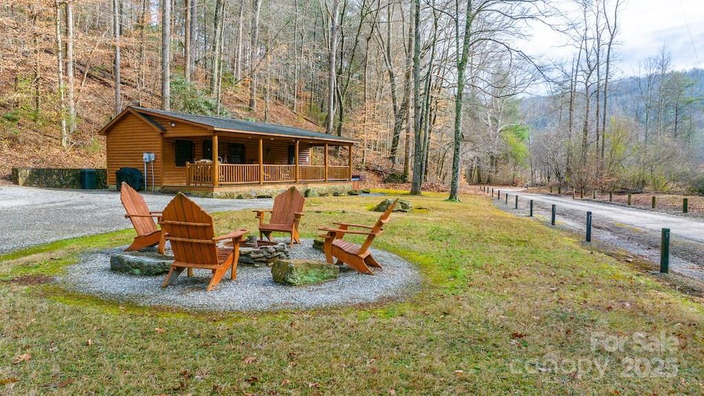 a view of a backyard with table and chairs