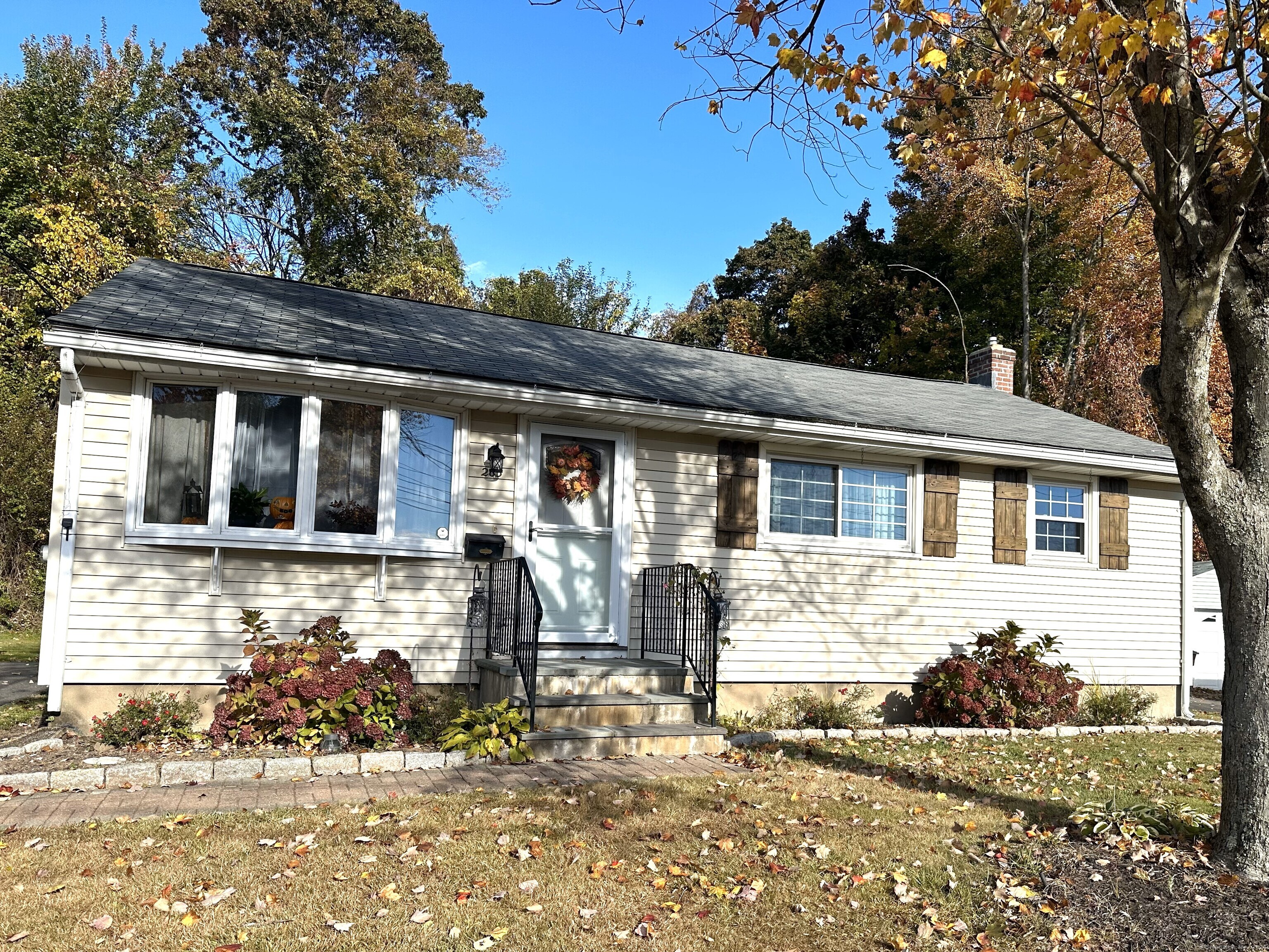 a front view of a house with a yard