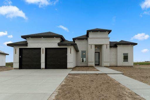 Prairie-style house with a garage