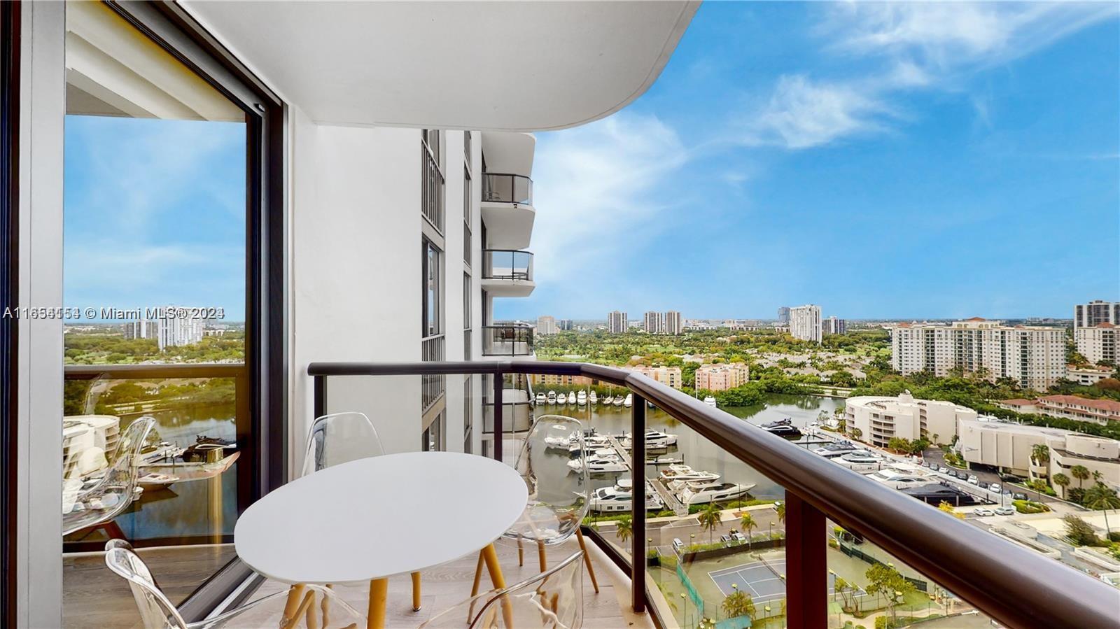 a view of a balcony with an outdoor seating