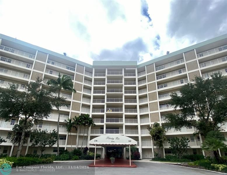 a front view of a building with street view