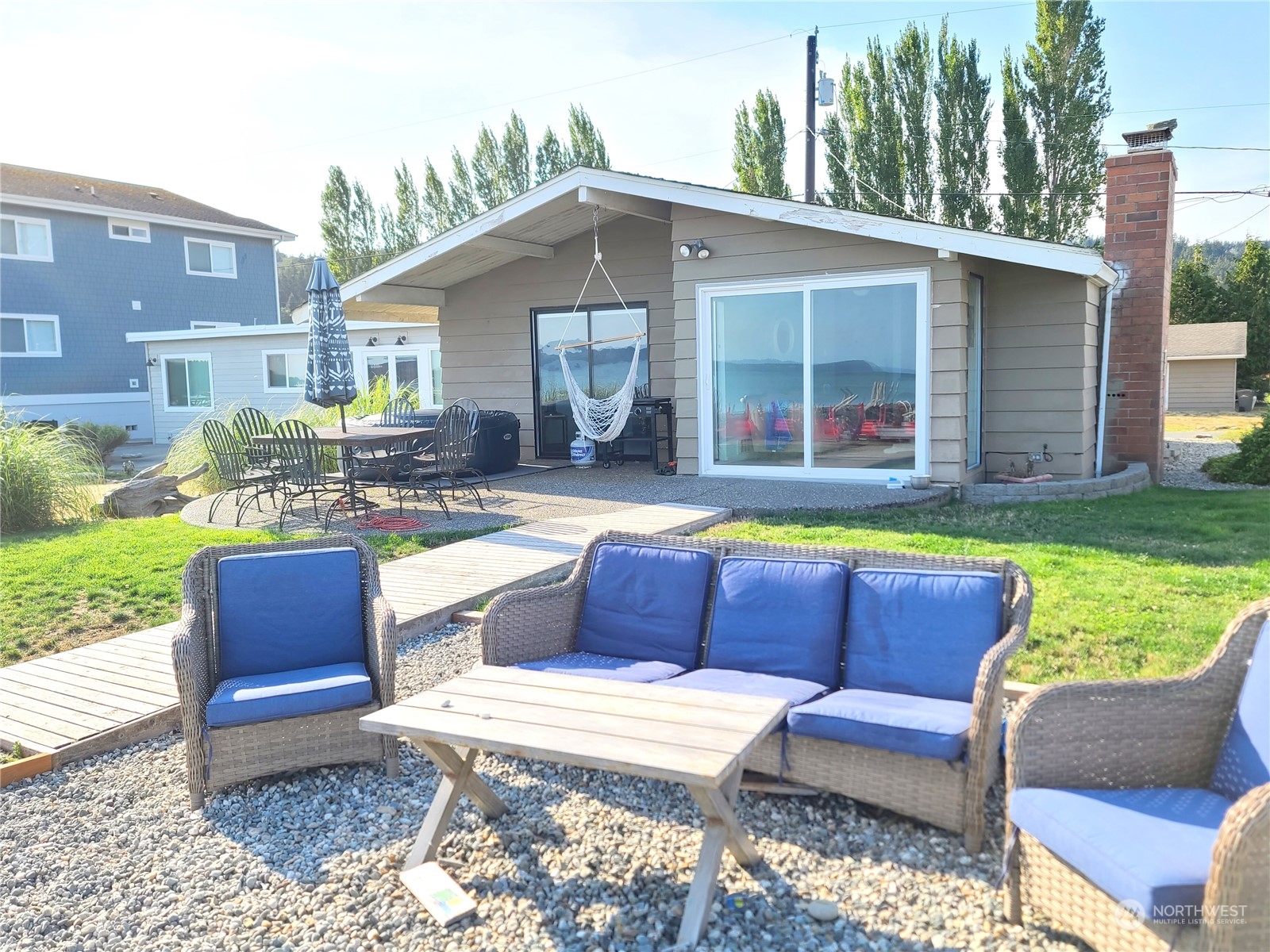 a view of patio with couches and pool