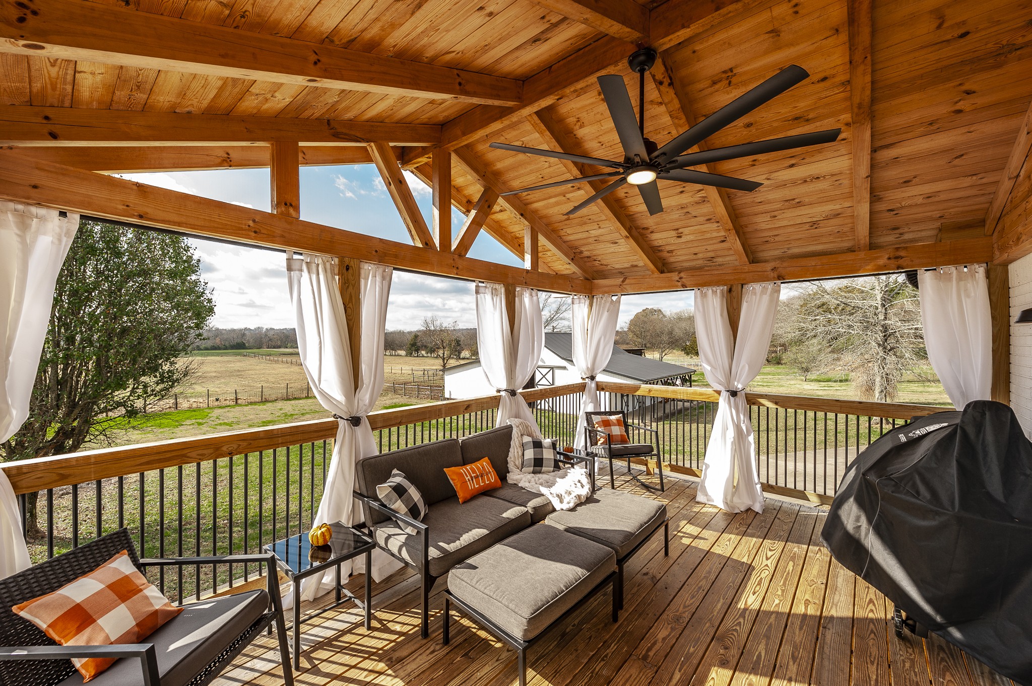 a view of a patio with wooden floor