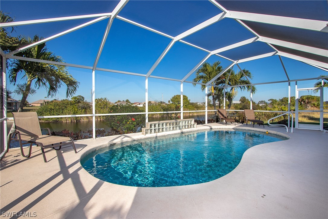 a view of a swimming pool with sitting area