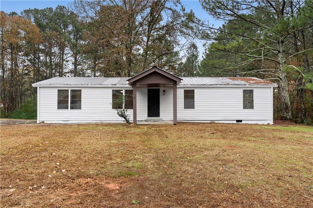 a house with trees in the background