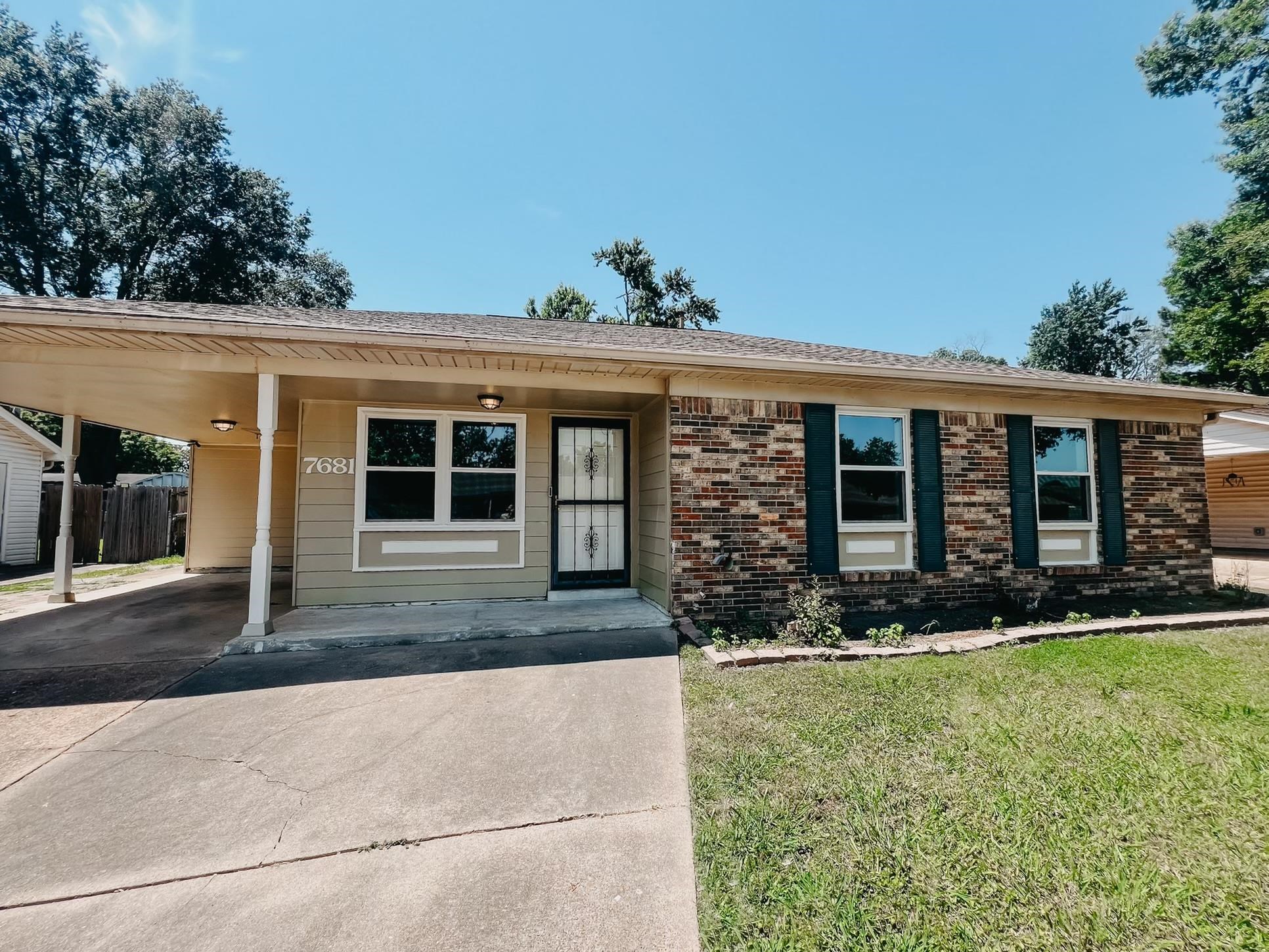 front view of a house with a yard