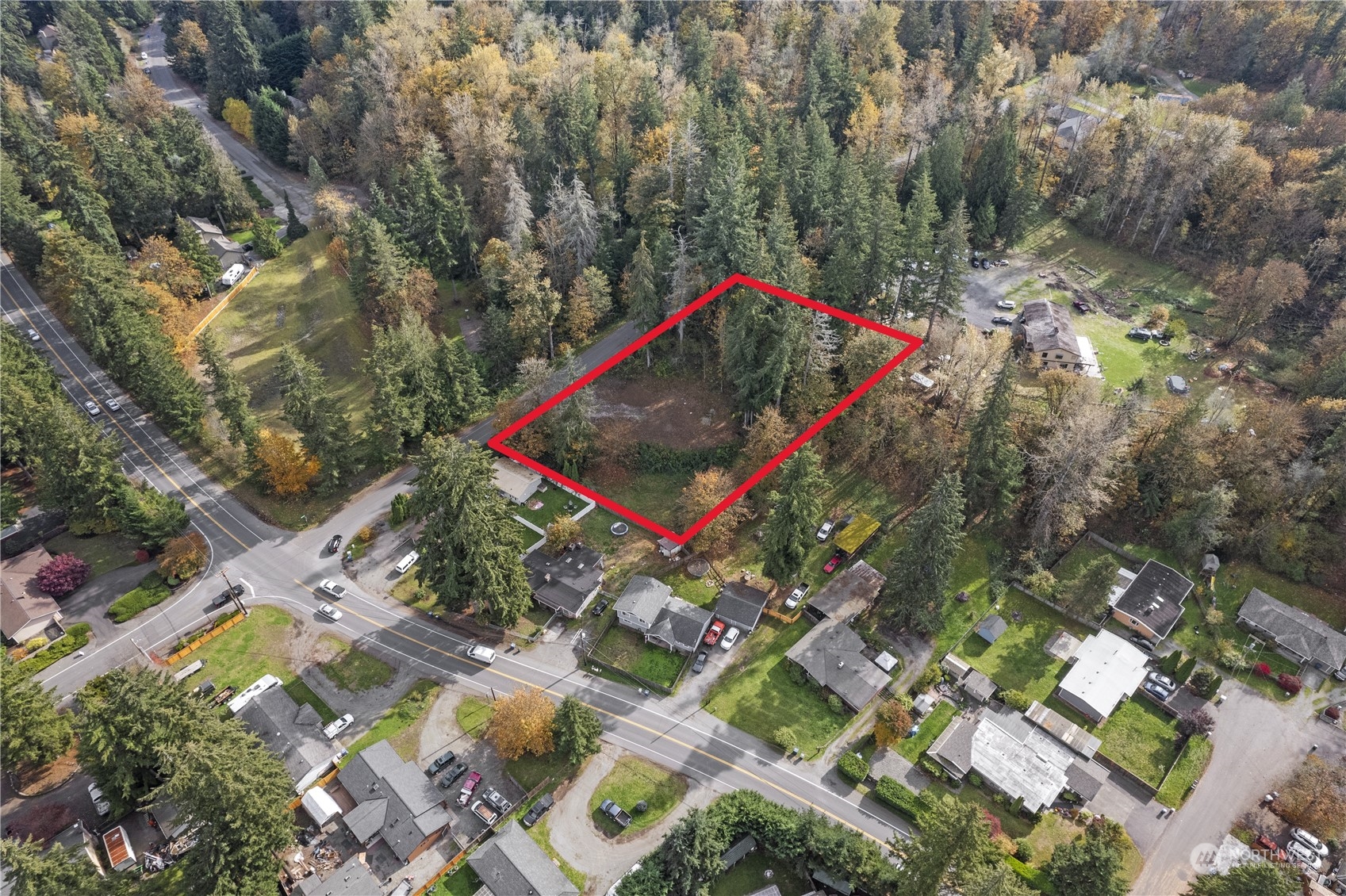 an aerial view of a houses with yard