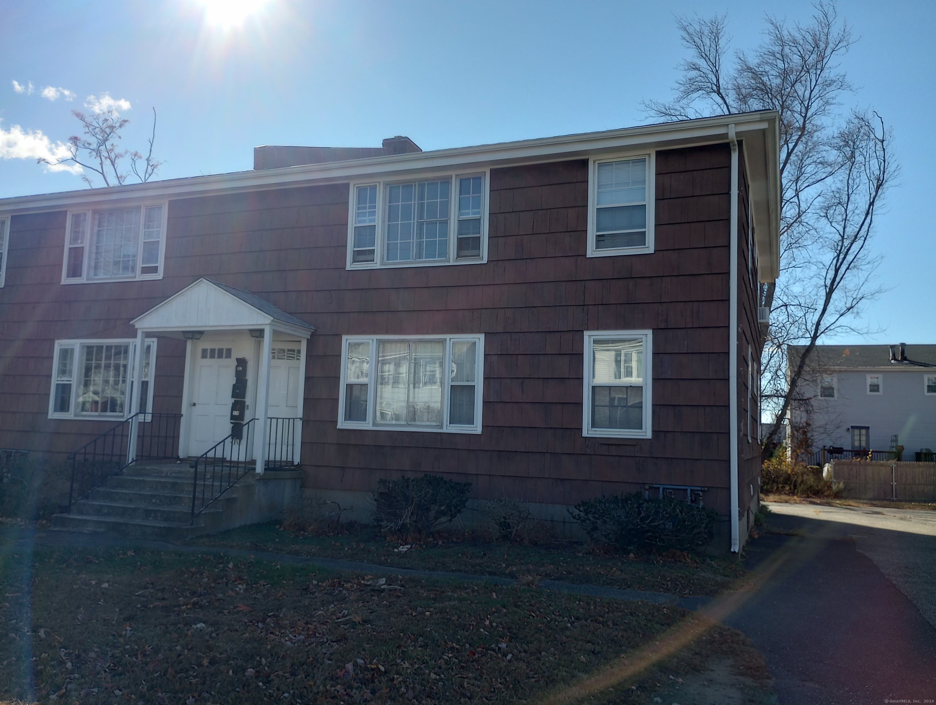 a front view of a house with yard