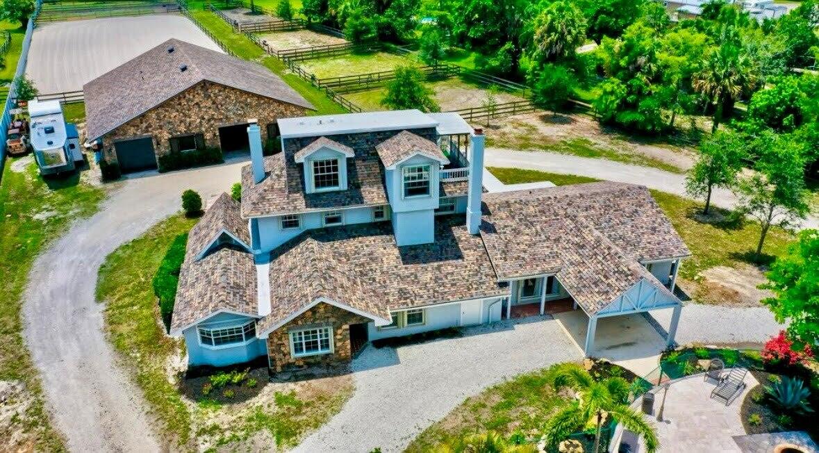 an aerial view of a house with a garden