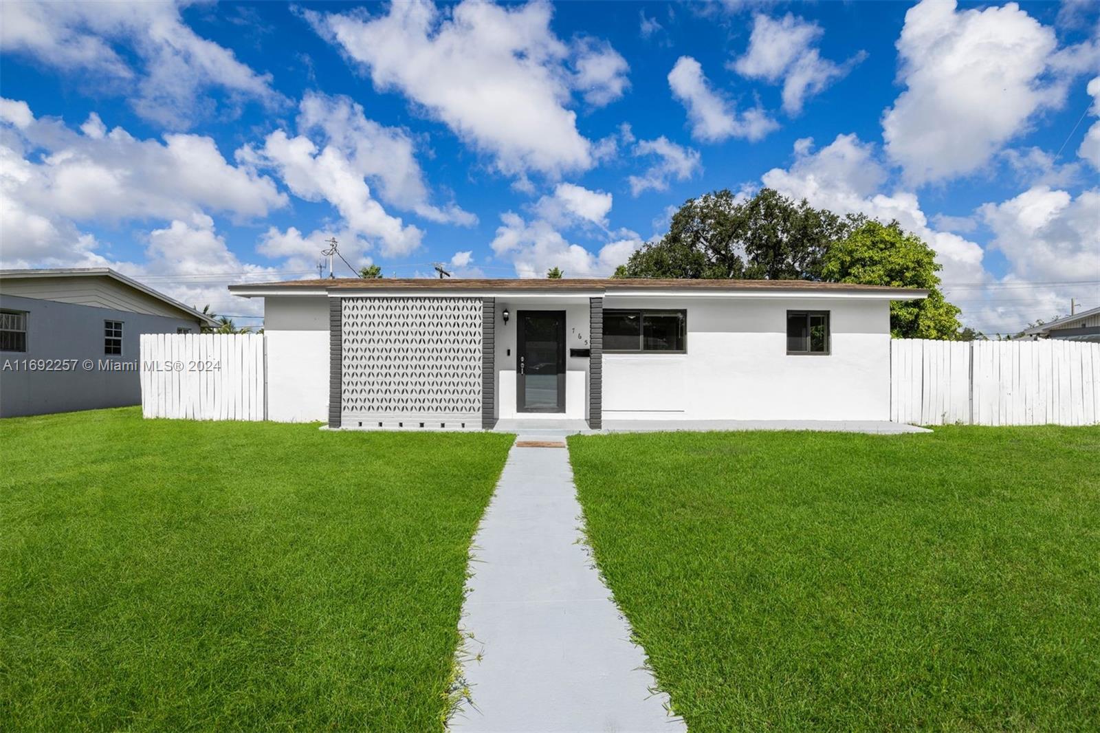 a front view of a house with yard