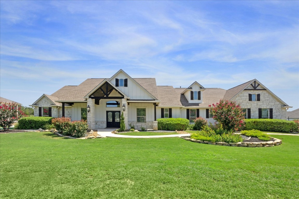 a front view of house with yard and green space