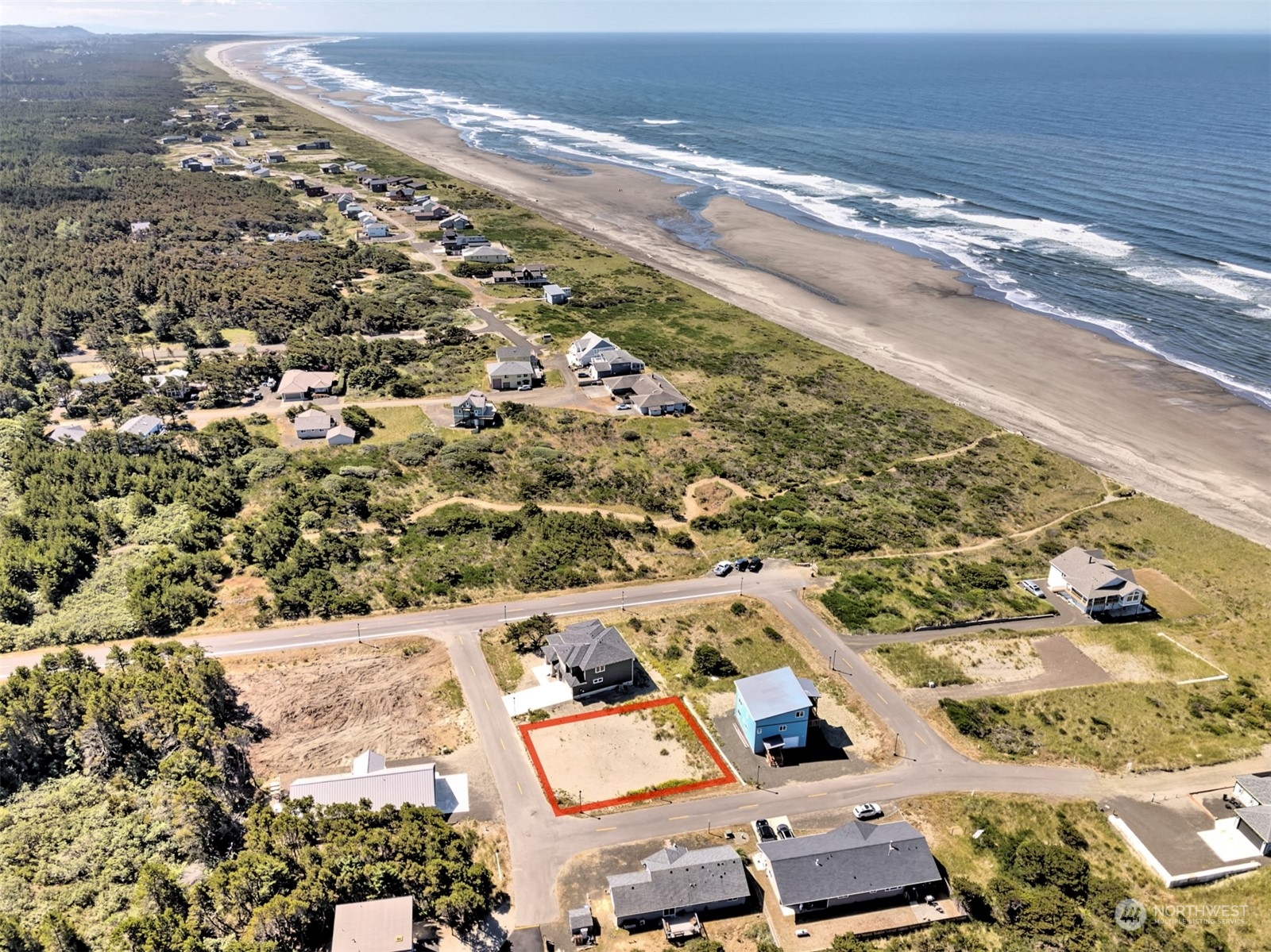 an aerial view of residential houses with outdoor space