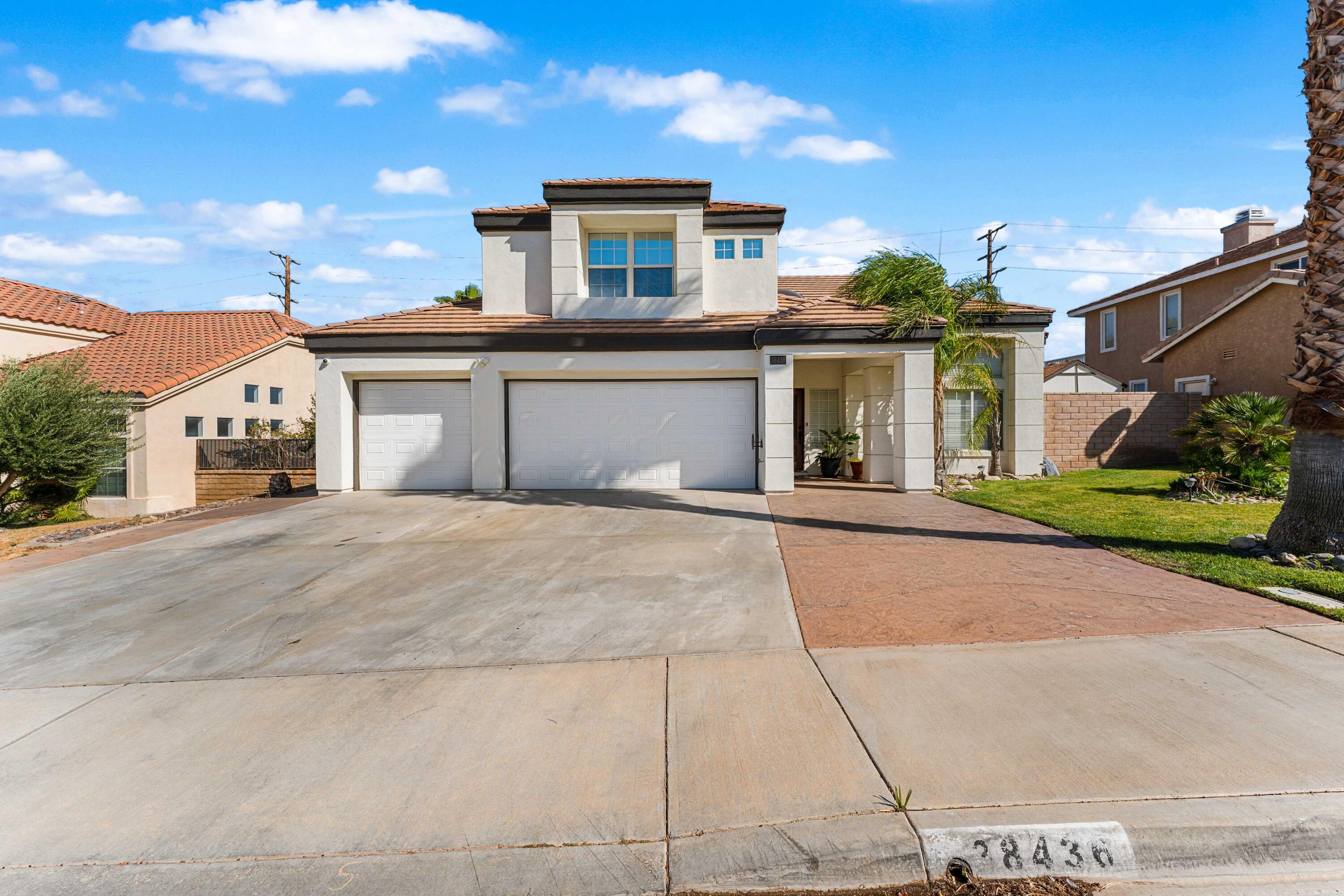 front view of a house with a street