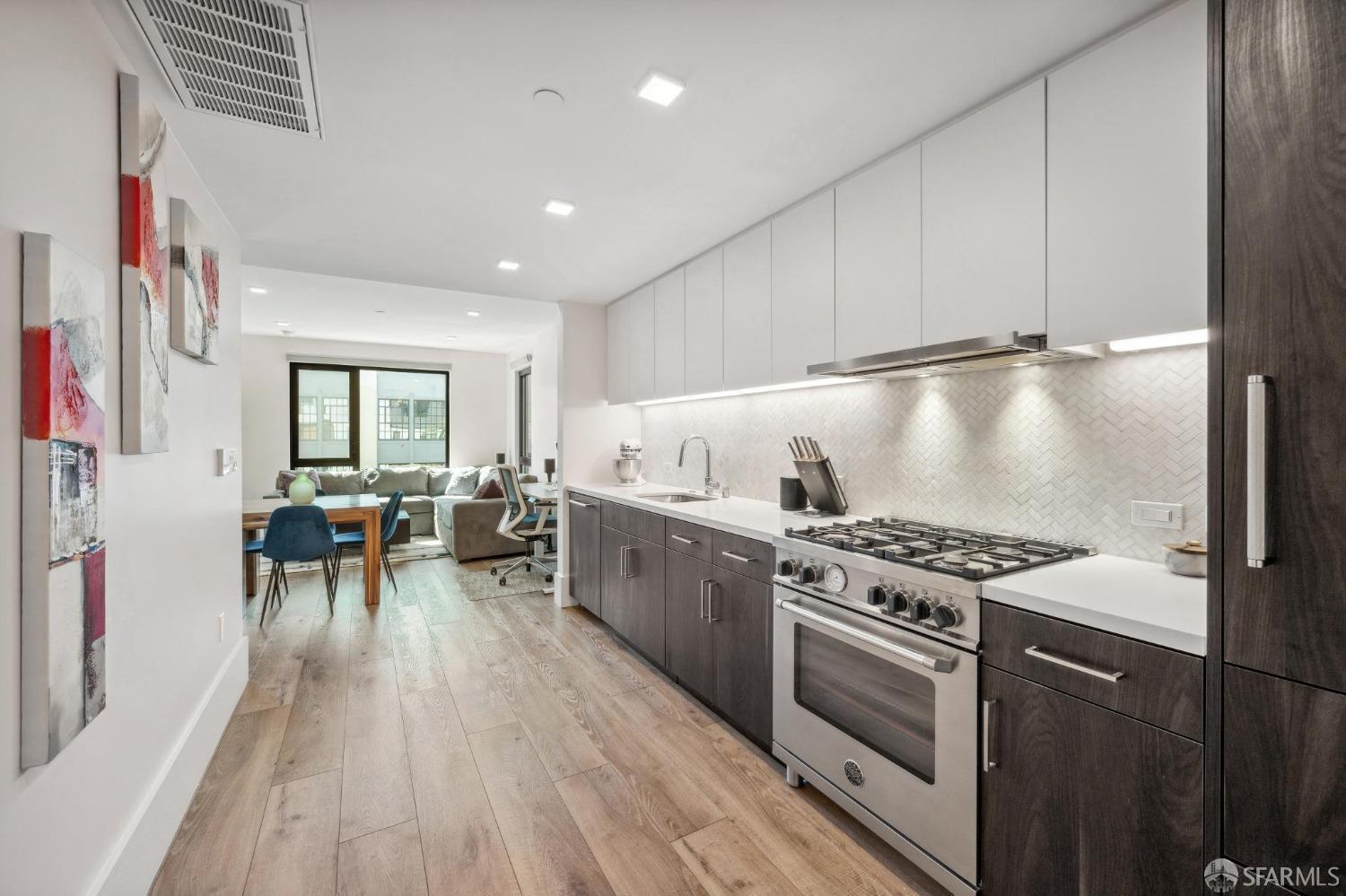 a kitchen with stove and cabinets