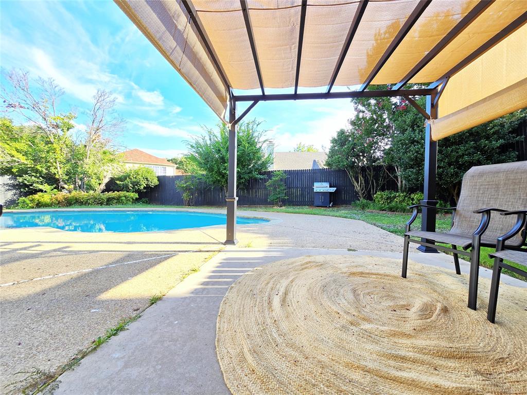 a view of a swimming pool with a porch