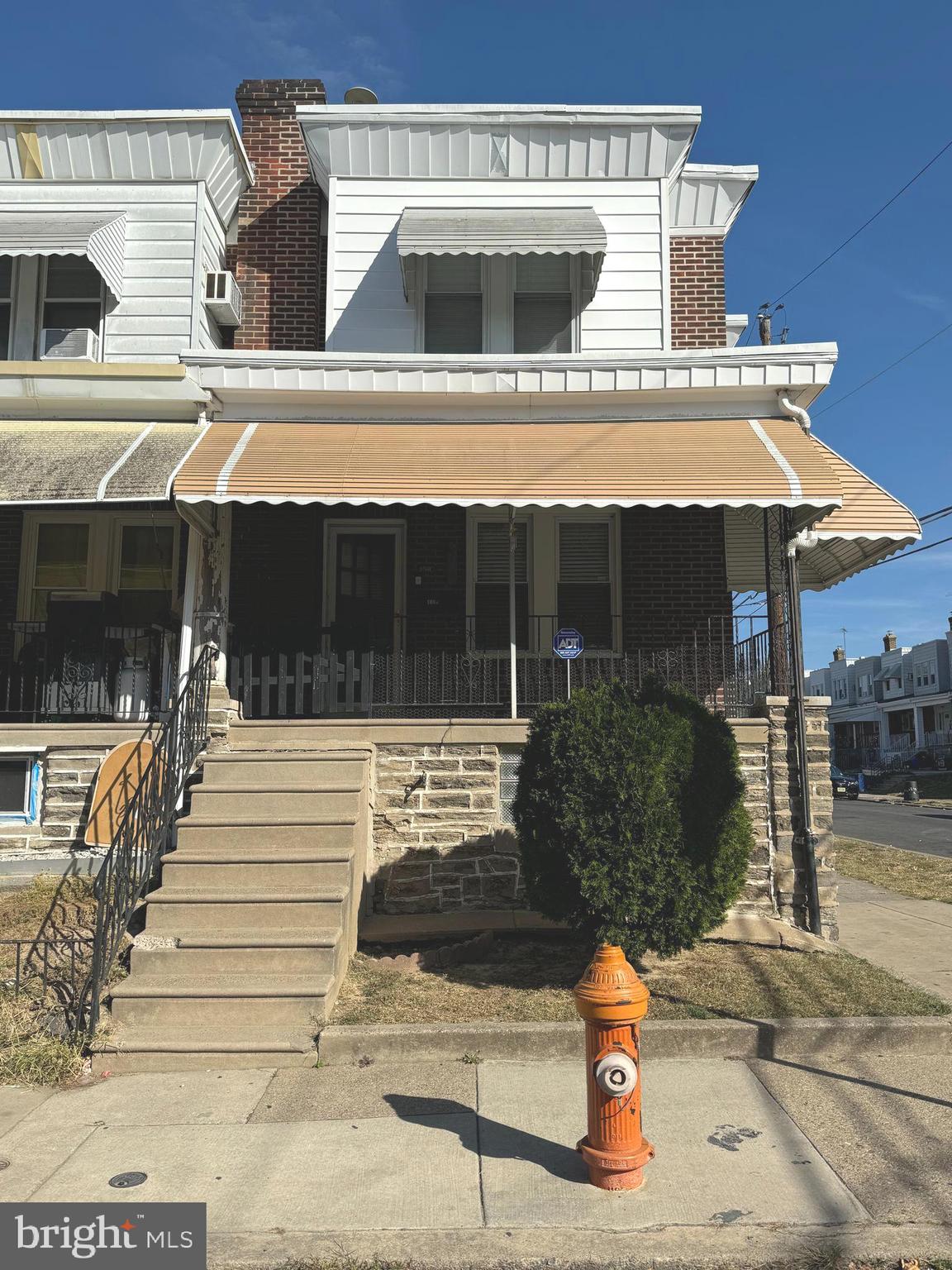 a front view of a house with parking