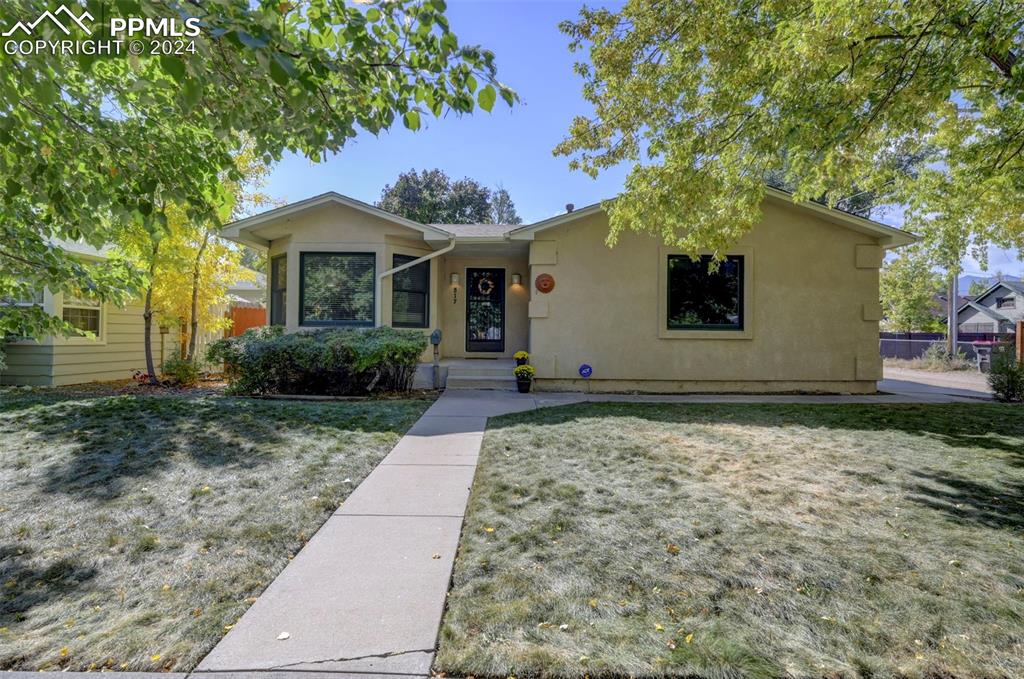 View of front of property with a front yard