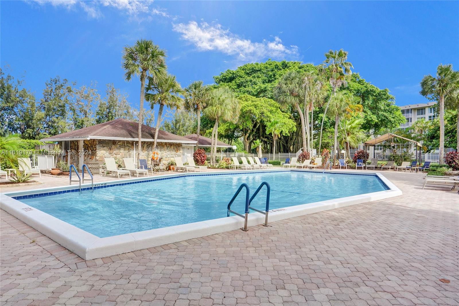 a view of a swimming pool with a patio